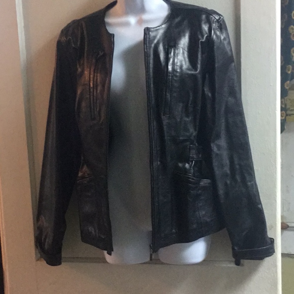 Vintage Unique Leather, w/ brass detailing.
